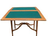 an image of a wooden table with a green cloth on top