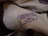 a close up of a military uniform with a stamp on it