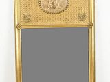 une image représentant un miroir à cadre doré sur lequel figure l'image d'un éléphant