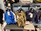 a display of clothing on a shelf in a store