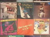 various cd ' s of various albums and cds are on the floor
