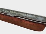 an old metal tub with a handle on it