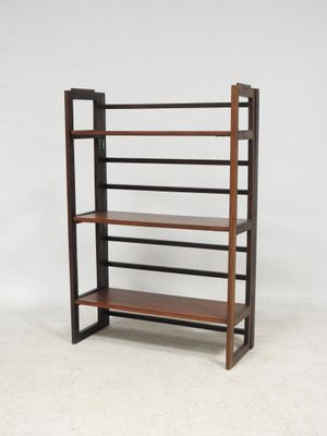 a wooden shelf with four shelves on top of it
