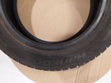 a close up of a tire on a cardboard box on a table