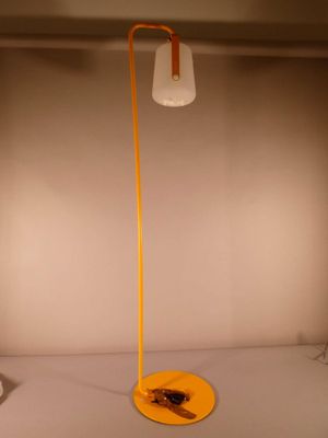 a lamp that is sitting on a table in a room