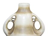 a white vase with holes in it on a white background
