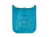 a blue purse with the letter h on it