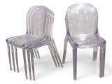 pair of clear plastic chairs sitting next to each other on a white surface