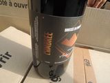 a bottle of wine sitting on top of a box