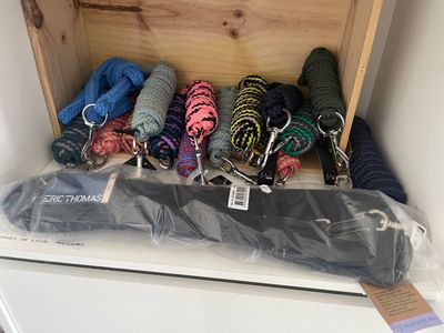 a wooden box filled with different types of knits