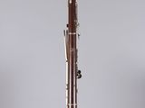 a close up of a bassoon on a clear surface