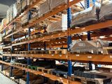 many shelves with boxes and boxes on them in a warehouse