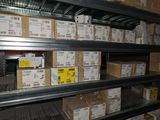 boxes are stacked on a shelf in a warehouse filled with boxes