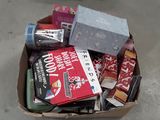 a cardboard box filled with assorted items on the floor