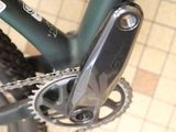a close up of a bicycle with a chain attached to it