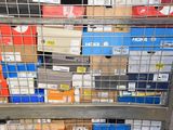 a metal rack with many boxes on top of it