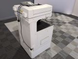 a white printer sitting on top of a white box