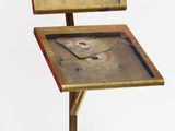 a small table with a clock on top of it