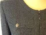 grey sweater with a zippered neckline and buttons on a mannequin mannequin mannequin mannequin mannequin mannequin manne