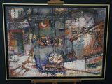 a picture of a painting on a easel in a room