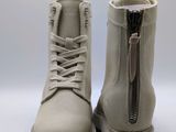 the boots are made of sued and have a zipper on the side