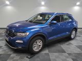 a blue volkswagen suv parked in a showroom
