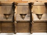 three wooden shelves with vases on them in a room