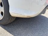 a close up of a car ' s tire on the street