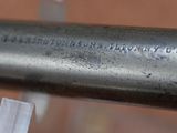 a close up of a metal pipe with a tag on it