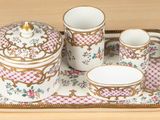 a tray with a tea set on it on a table