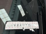 a picture of a sticker on the windshield of a car