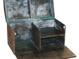 a wooden box with two open compartments sitting on a table