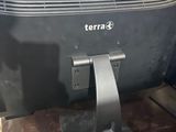 a black television sitting on top of a wooden table