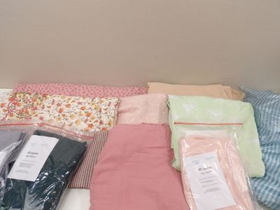 a bed with a lot of blankets on it