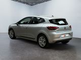 the rear end of a silver car in a white room
