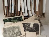 a lot of old photos in a box on the table