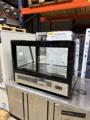 a microwave sitting on top of a counter in a store