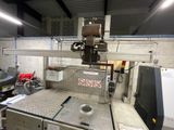 a machine that is sitting in a room with a lot of machines