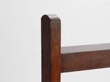 a close up of a wooden bench with a white background