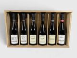 six bottles of wine in a wooden box