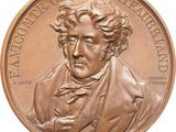 une image montrant un gros plan d'une pièce de monnaie sur laquelle figure le visage d'un homme