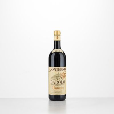 a bottle of red wine sitting on top of a table