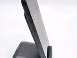 a cell phone that is sitting on top of a stand