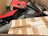 a cardboard box filled with assorted items in a room