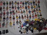 a lot of action figures that are on a table
