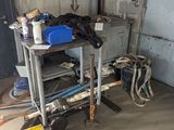 an image of a garage with tools on the floor