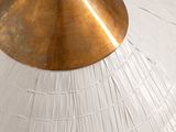 a close up of a metal object on a white surface