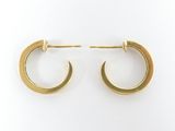 pair of gold toned hoop earrings on a white background