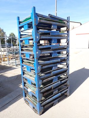an image of a stack of metal trays on a pallet