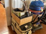 a picture of a vacuum cleaner and a duster in a room